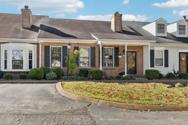 a kitchen with stainless steel appliances granite countertop a refrigerator sink and cabinets