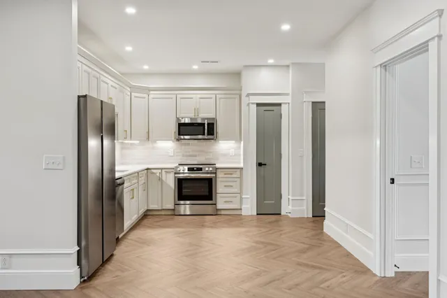 a view of a balcony with wooden floor