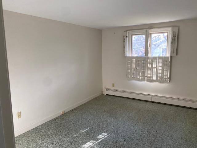 119 Sheaffer Road Centerville, MA 02632 - Photo 16 of 24 an empty room with wooden floor and windows