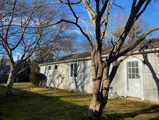 119 Sheaffer Road Centerville, MA 02632 - Photo 5 of 24 a view of a house with a tree beside it