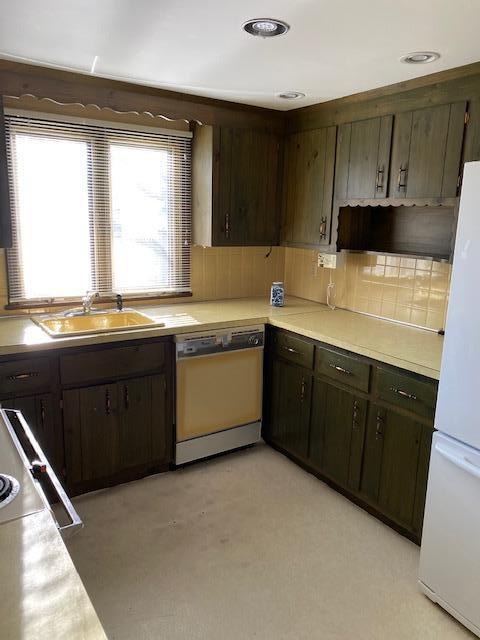 119 Sheaffer Road Centerville, MA 02632 - Photo 9 of 24 a kitchen with a sink a stove and cabinets