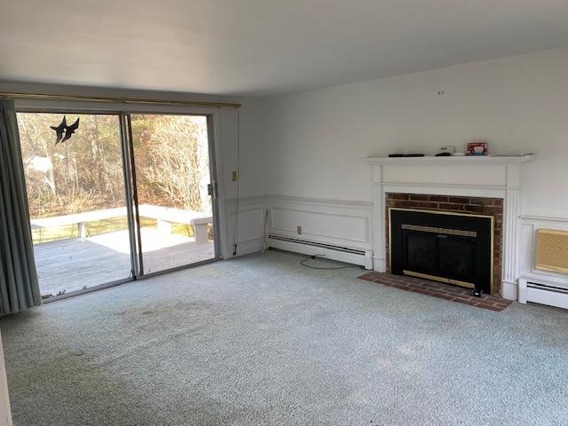 119 Sheaffer Road Centerville, MA 02632 - Photo 10 of 24 a view of an empty room with a fireplace