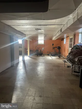 a view of a hallway with seating area