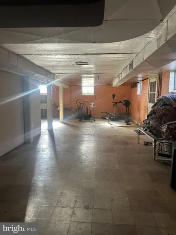 a view of a hallway with seating area