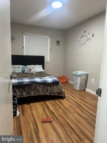 a bedroom with a bed and a table