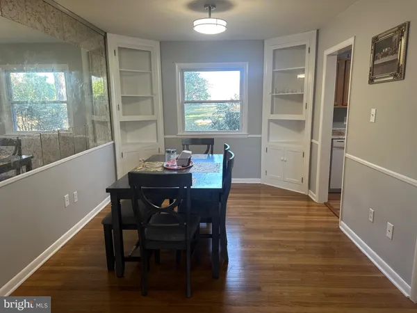 a view of a dining room with furniture and window