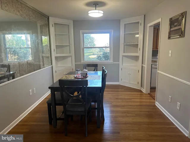 a view of a dining room with furniture and window