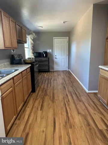 a kitchen with sink and cabinets