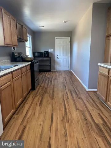 a kitchen with sink and cabinets