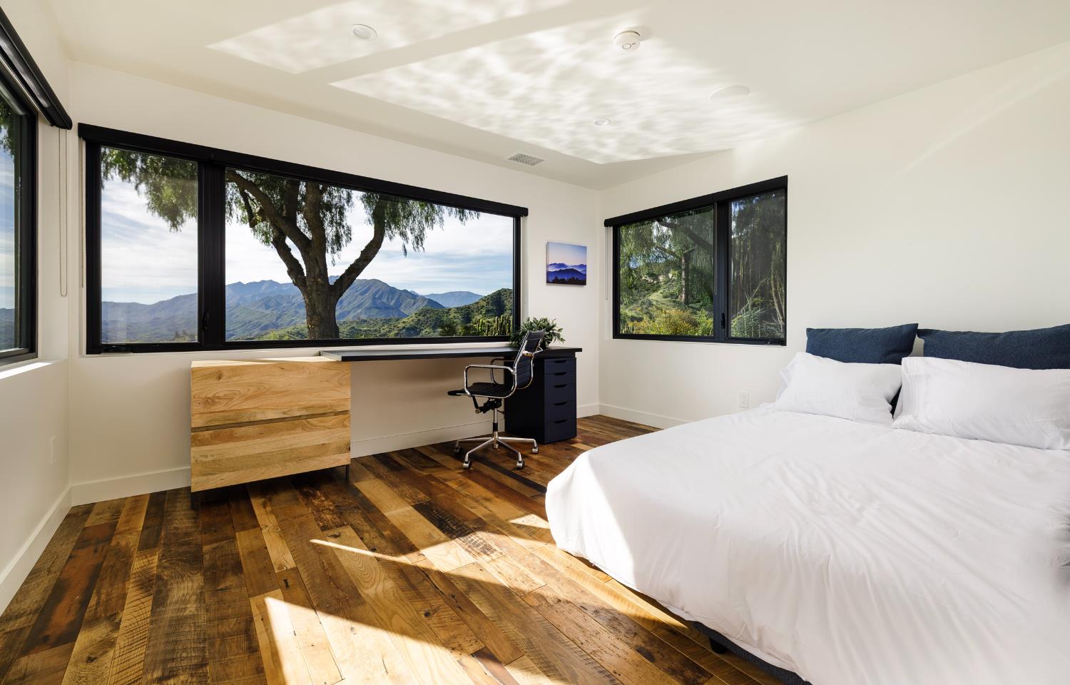1417 Foothill Road Ojai, CA 93023 - Photo 25 of 41 a bedroom with a bed window and a flat tv screen