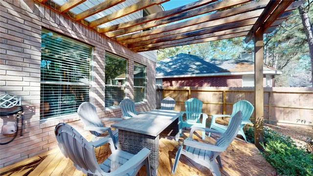 a outdoor space with patio the couches and a dining table and chairs with outer view