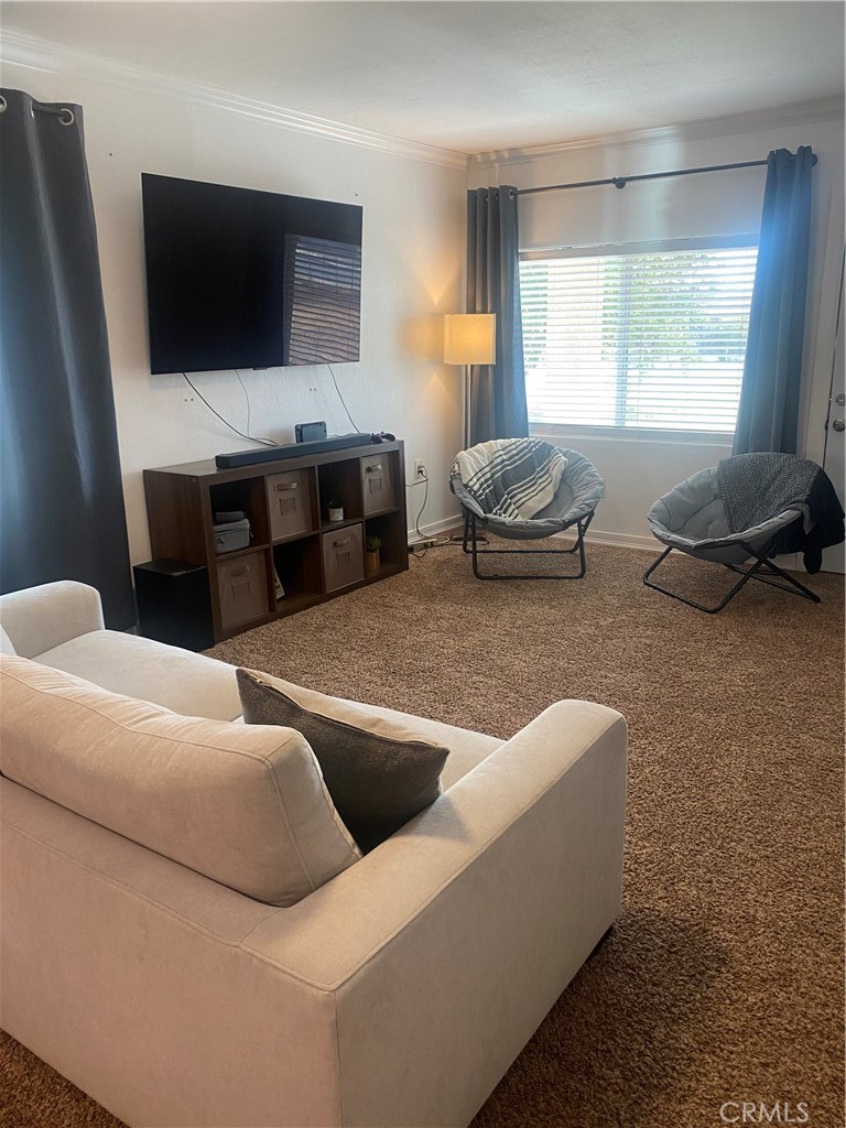 2302 Norwalk Street Delano, CA 93215 - Photo 5 of 9 a living room with furniture and a flat screen tv