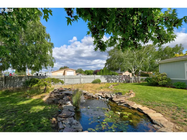 a view of a lake with a yard