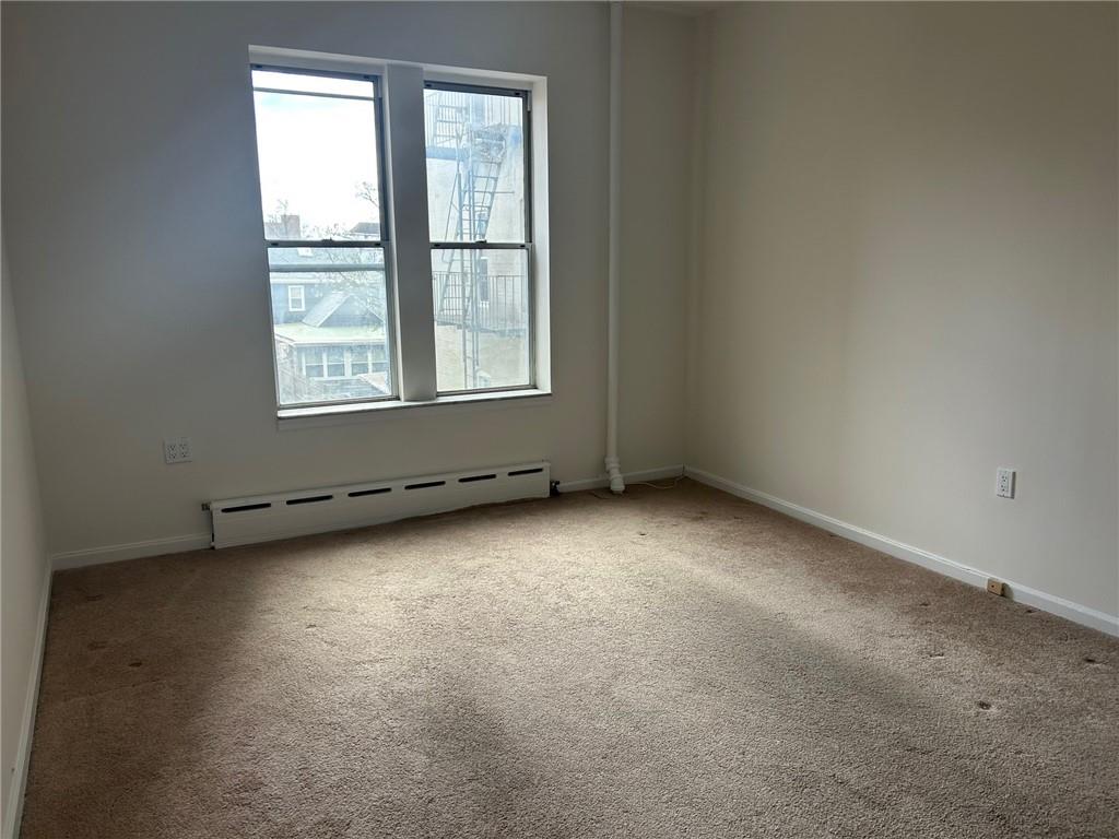 9031 Fort Hamilton Parkway, Unit 2B Brooklyn, NY 11209 - Photo 5 of 11 an empty room with a window