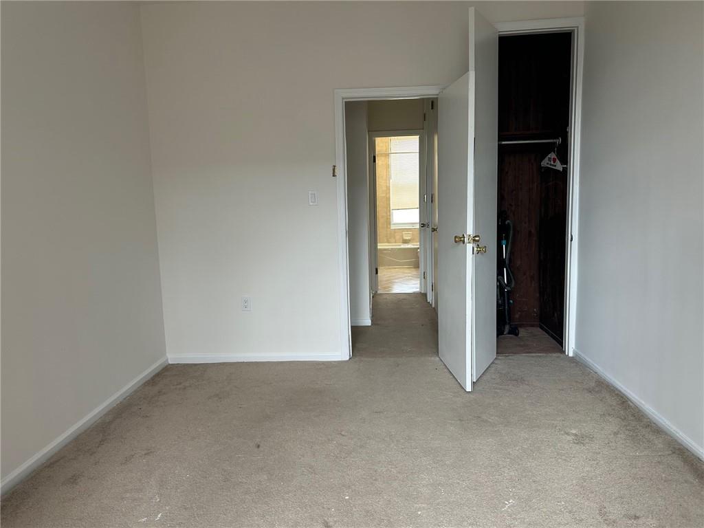 9031 Fort Hamilton Parkway, Unit 2B Brooklyn, NY 11209 - Photo 10 of 11 an empty room that has a grey walls