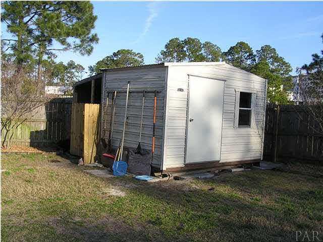 356 Quigley Road Pensacola, FL 32506 - Photo 7 of 15 Shed is wired for electric and tied down.