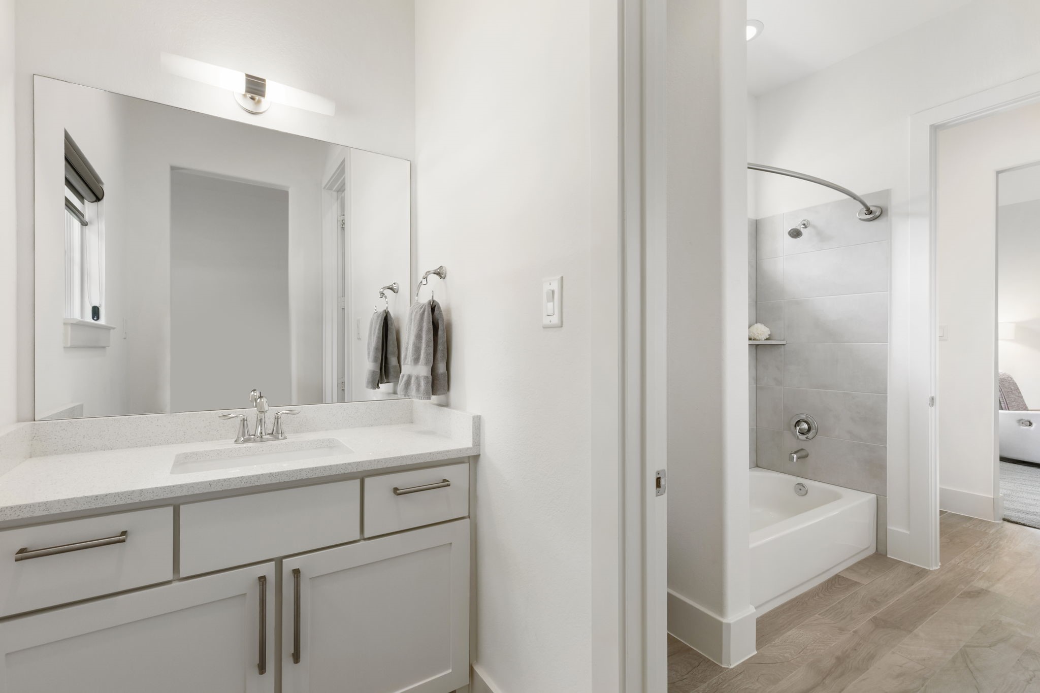 3918 Almond Court Spring, TX 77386 - Photo 24 of 42 a bathroom with a tub sink and mirror