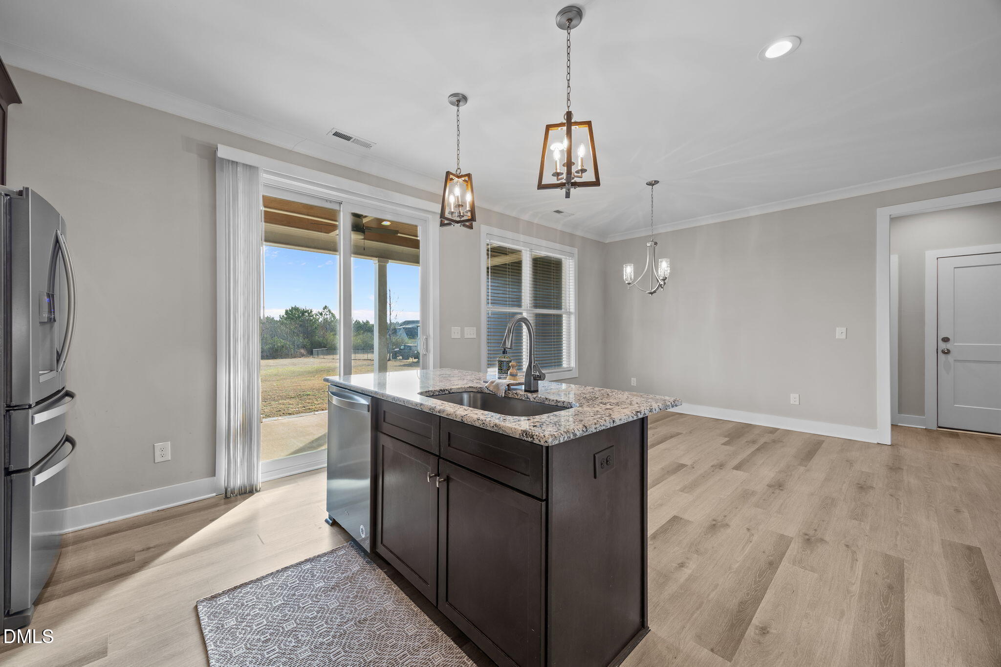 363 Mulberry Road Spring Hope, NC 27882 - Photo 15 of 35 a kitchen with stainless steel appliances granite countertop a stove and a refrigerator
