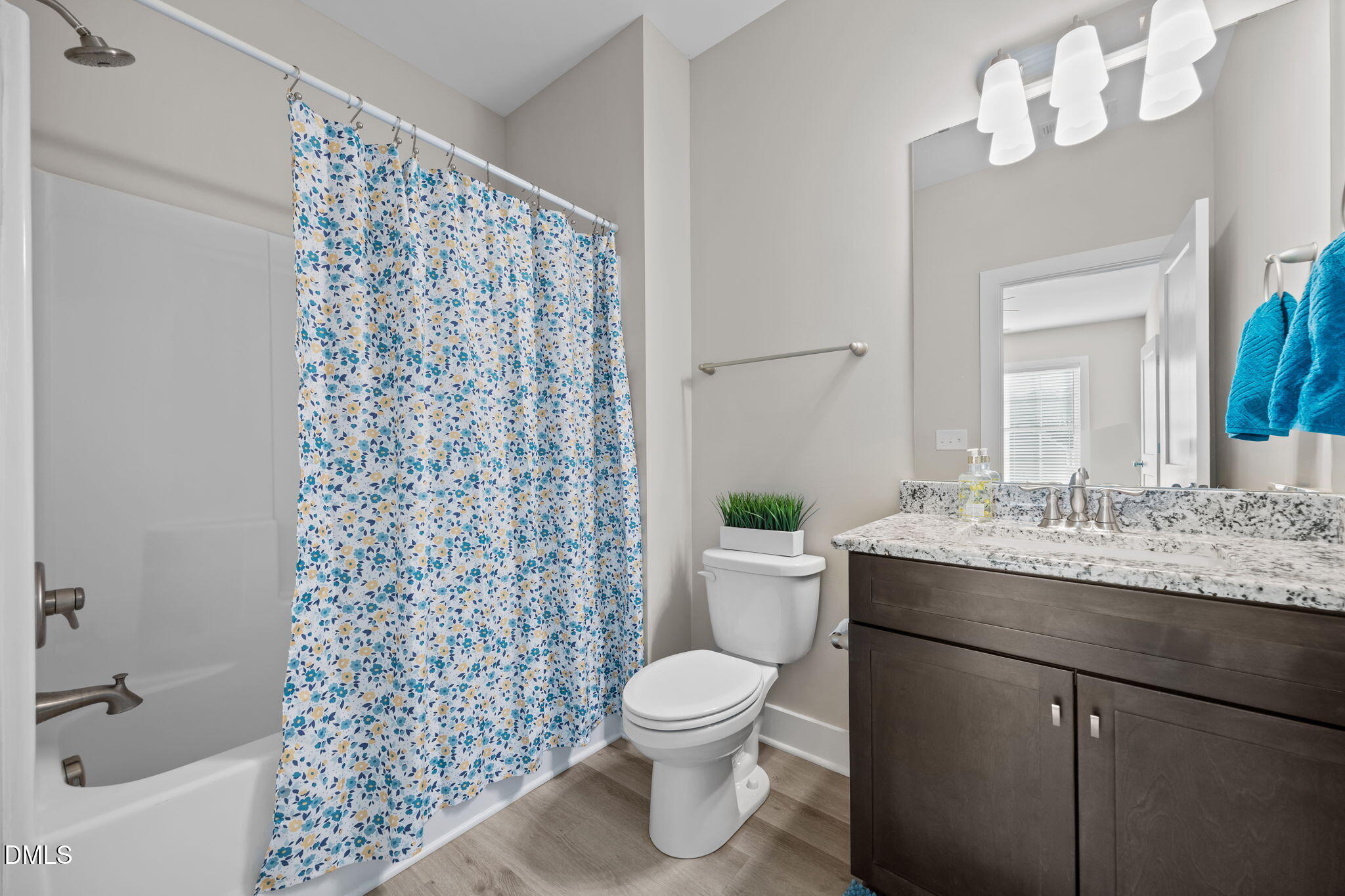 363 Mulberry Road Spring Hope, NC 27882 - Photo 27 of 32 a bathroom with a granite countertop sink a toilet and a mirror