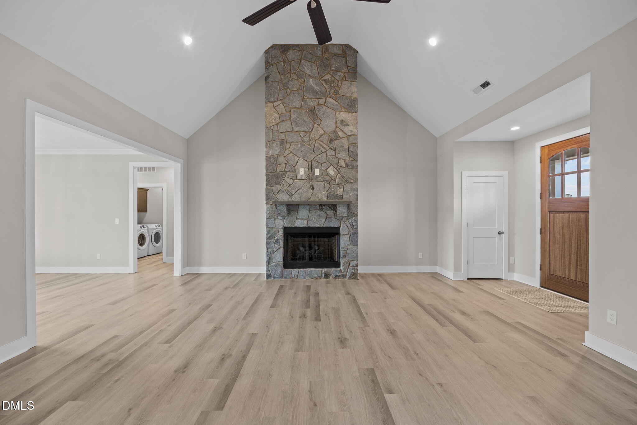 363 Mulberry Road Spring Hope, NC 27882 - Photo 3 of 32 a view of an empty room with wooden floor and a fireplace