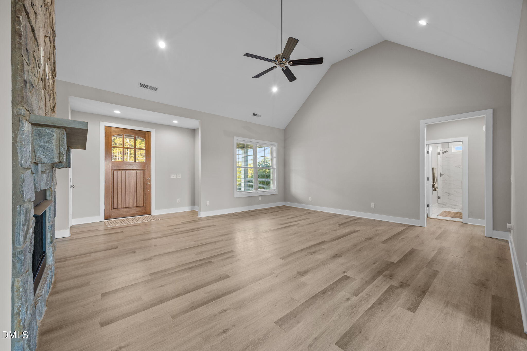 363 Mulberry Road Spring Hope, NC 27882 - Photo 4 of 35 a view of an empty room with window and wooden floor