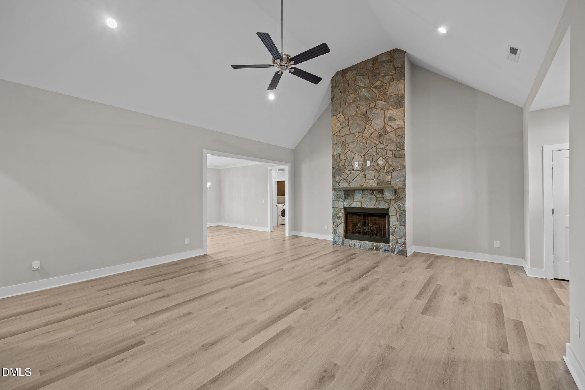 363 Mulberry Road Spring Hope, NC 27882 - Photo 7 of 35 a view of a livingroom with a fireplace and a ceiling fan
