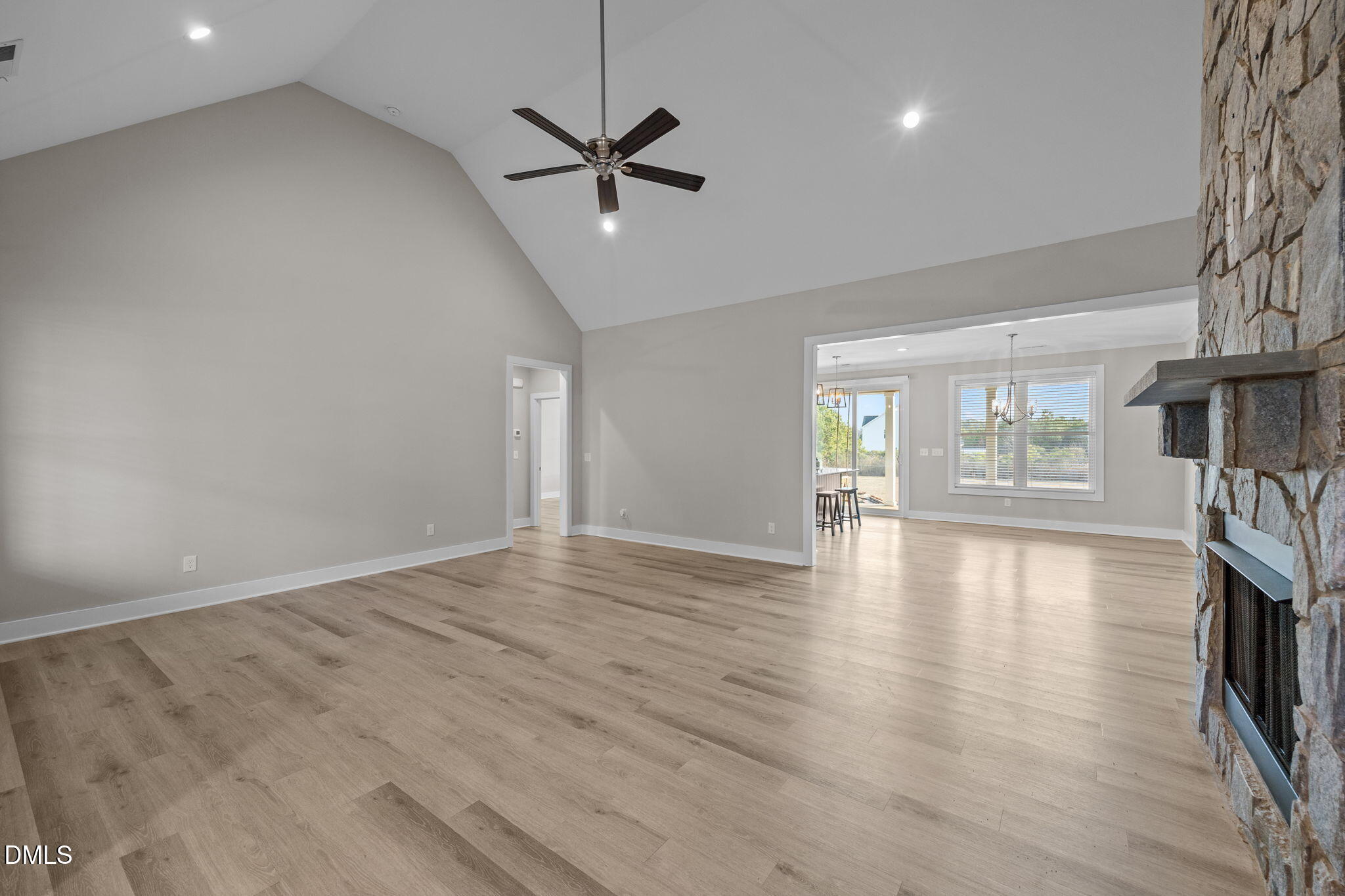 363 Mulberry Road Spring Hope, NC 27882 - Photo 8 of 35 a view of an empty room with wooden floor and a window