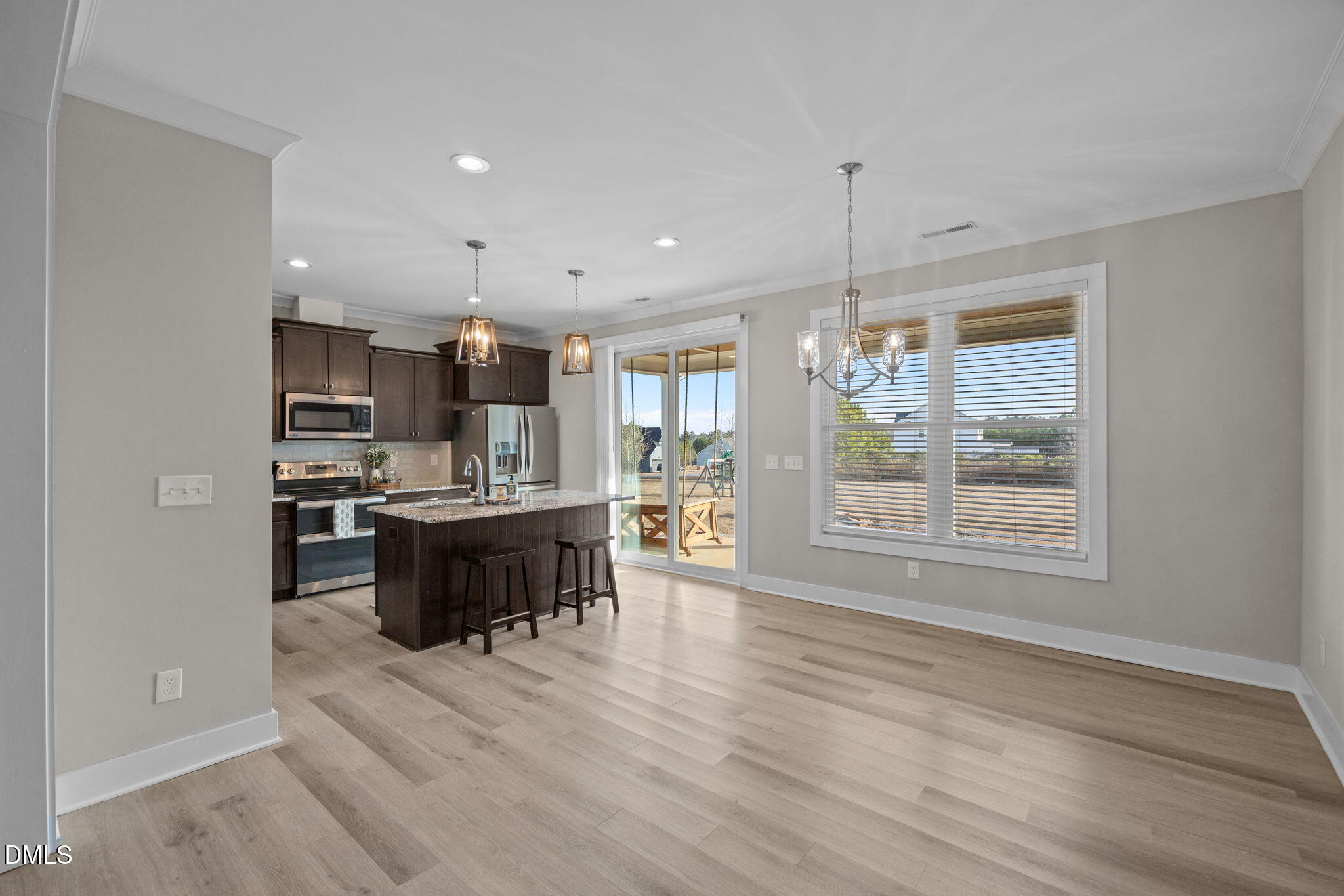 363 Mulberry Road Spring Hope, NC 27882 - Photo 9 of 35 a large kitchen with kitchen island a sink stainless steel appliances and cabinets