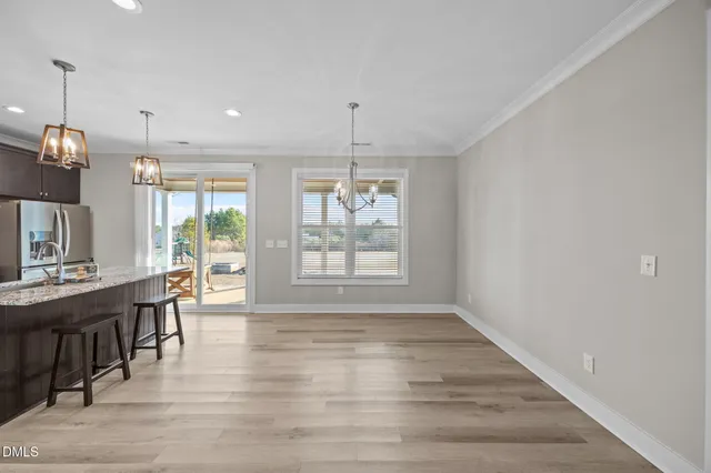 a view of a kitchen and dining room
