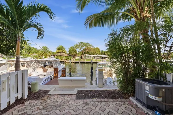a balcony with view of palm trees