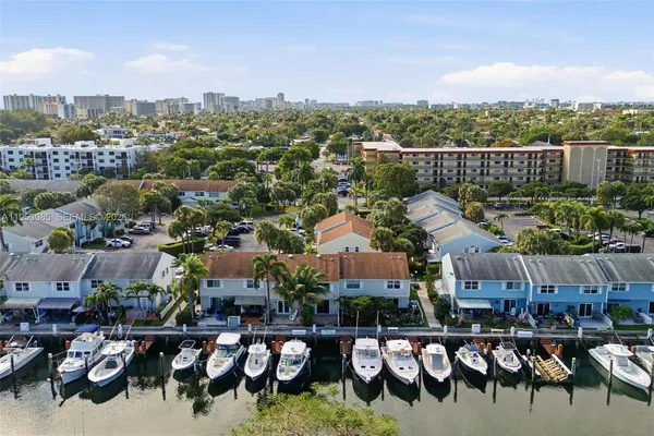 an aerial view of residential houses with outdoor space