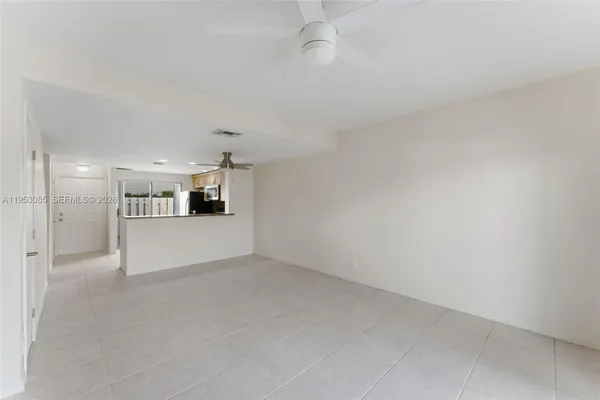 a kitchen with stainless steel appliances granite countertop a refrigerator sink and stove
