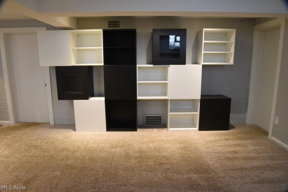 3602 Warren Road Cleveland, OH 44111 - Photo 17 of 24 Other side of the finished basement. Built-ins are anchored to the wall. Seller will remove if needed, but they're perfect for a playroom set up, collector, man cave, etc.