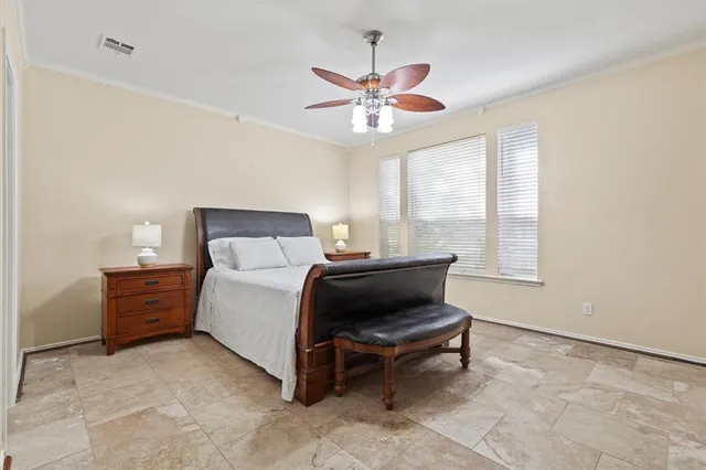 a bedroom with a bed and window