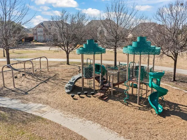 a view of a backyard with sitting area