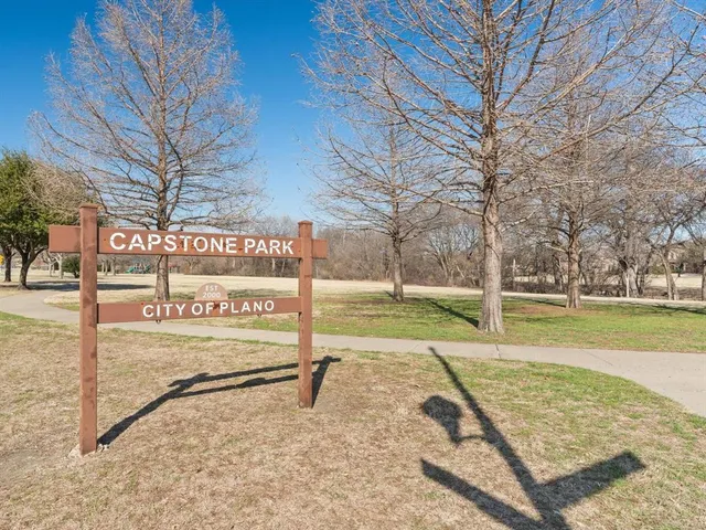 a view of a street with yard