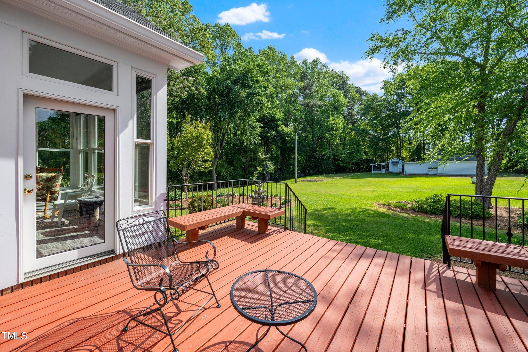 8733 Crowder Road Raleigh, NC 27603 - Photo 32 of 50 a view of outdoor space yard deck patio and outdoor kitchen