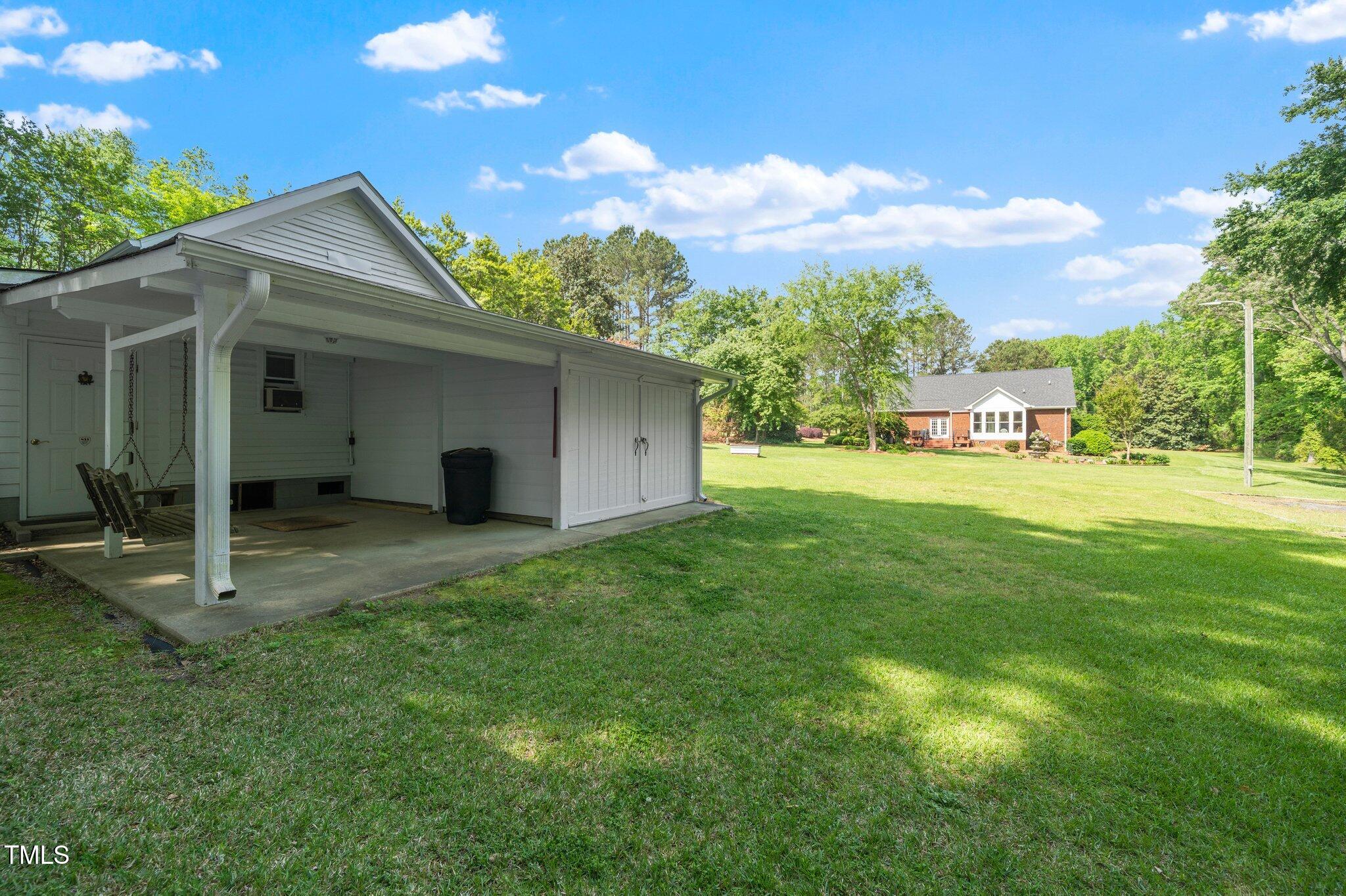 8733 Crowder Road Raleigh, NC 27603 - Photo 45 of 50 a view of a house with backyard and garden