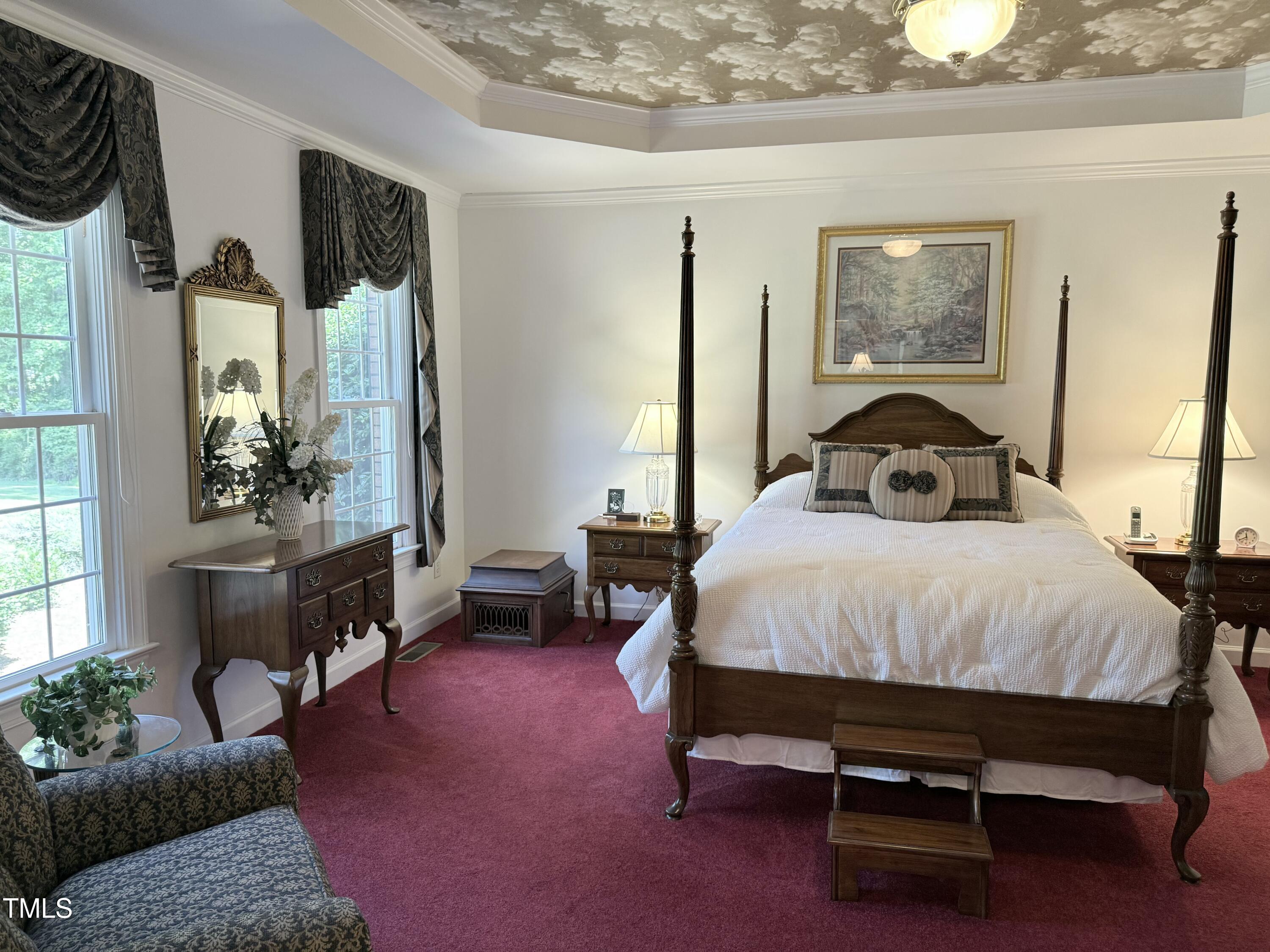 8733 Crowder Road Raleigh, NC 27603 - Photo 7 of 50 a spacious bedroom with a bed and a window