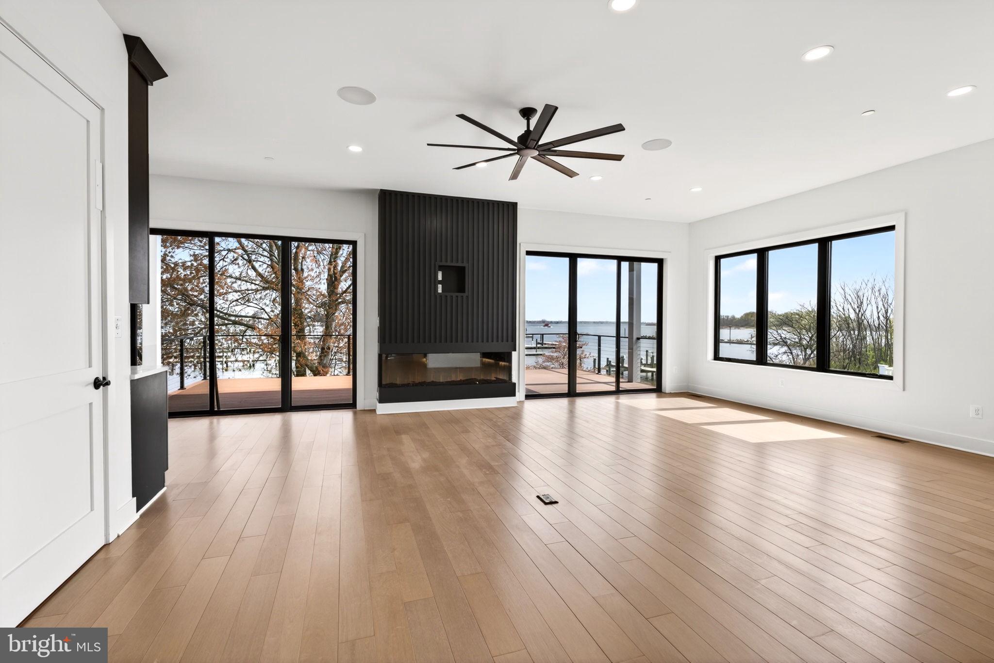 2708 6th Street Sparrows Point, MD 21219 - Photo 45 of 131 a view of an empty room with wooden floor and a window