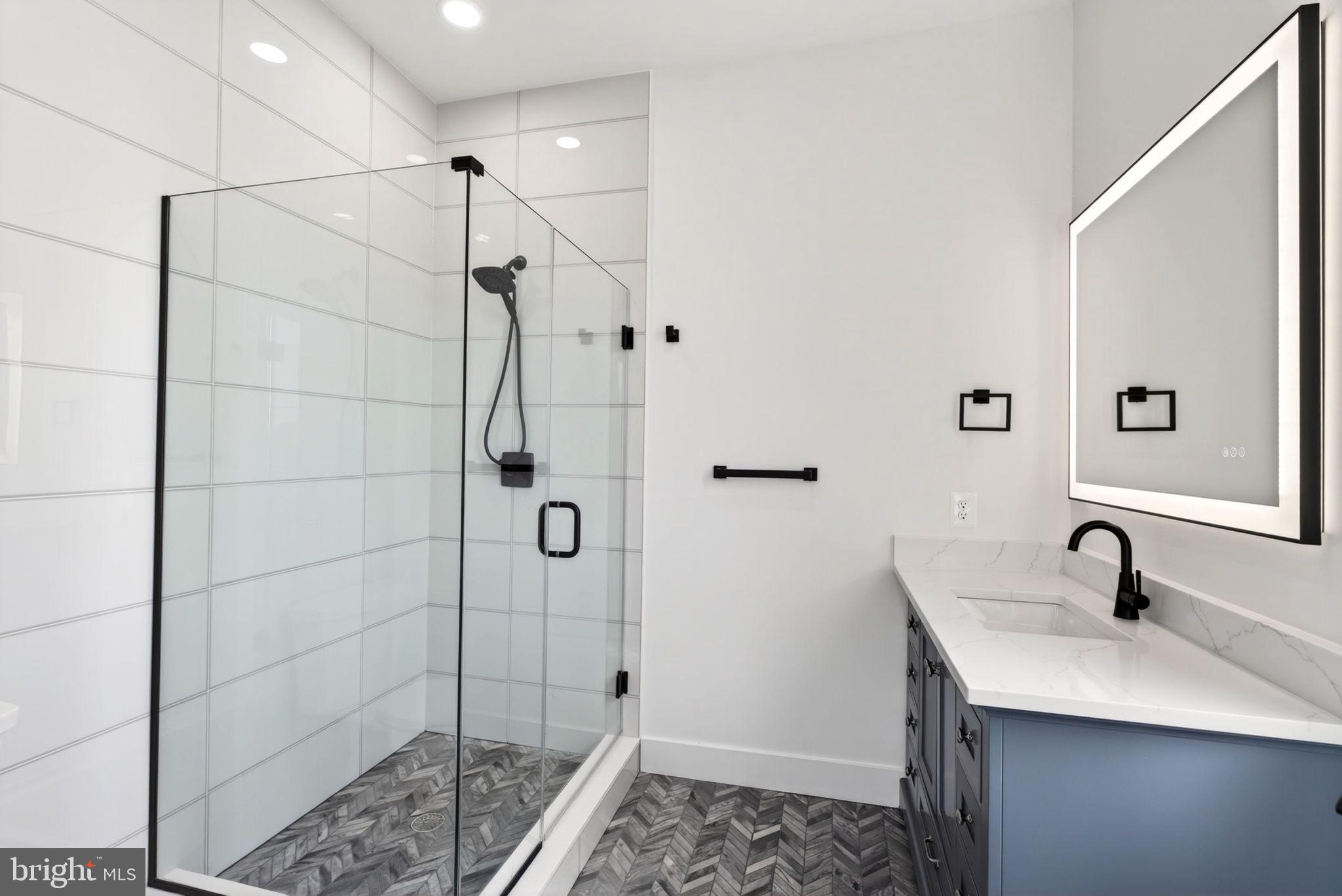 2708 6th Street Sparrows Point, MD 21219 - Photo 58 of 131 a bathroom with a sink and shower