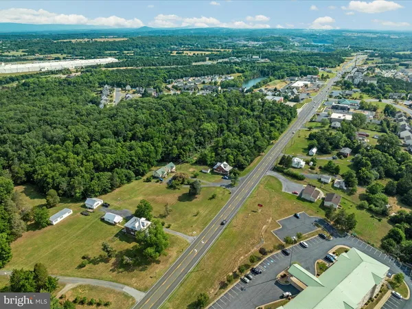 an aerial view of a residential houses with outdoor space