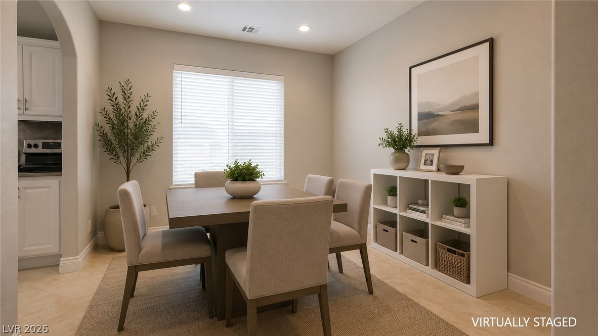 87 Tall Ruff Drive Las Vegas, NV 89148 - Photo 44 of 71 A refined dining space connects seamlessly to the kitchen, offering both elegance and everyday functionality.