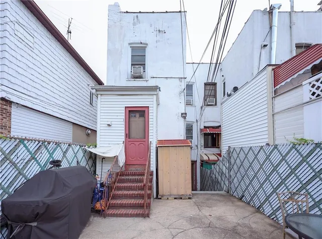 a view of a house with wooden wall and a stairs