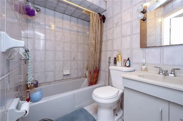 a bathroom with a sink a toilet and bathtub