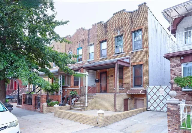 a view of a brick building with many windows