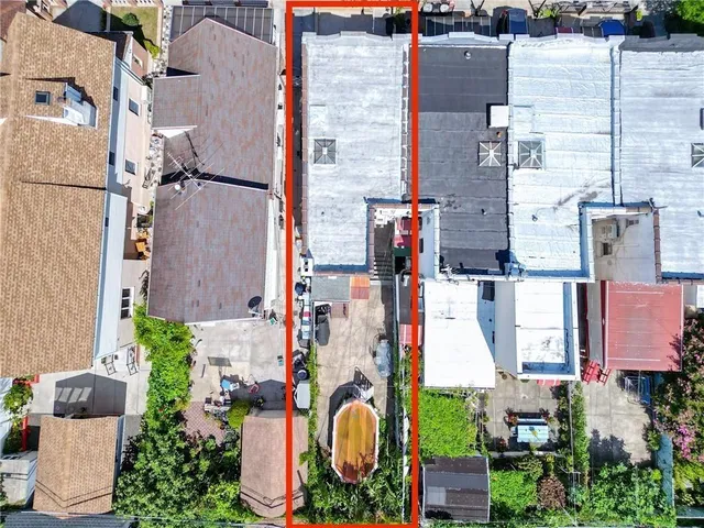 an aerial view of houses with outdoor space