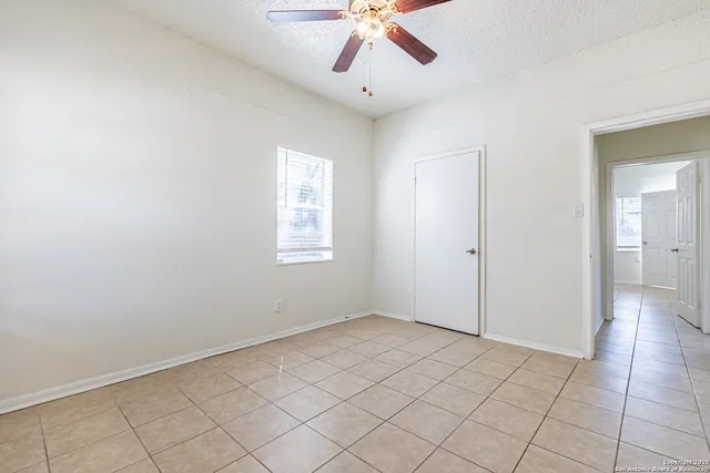 a view of an empty room and window