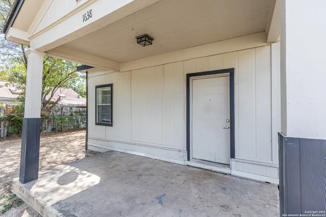a view of a big room with windows