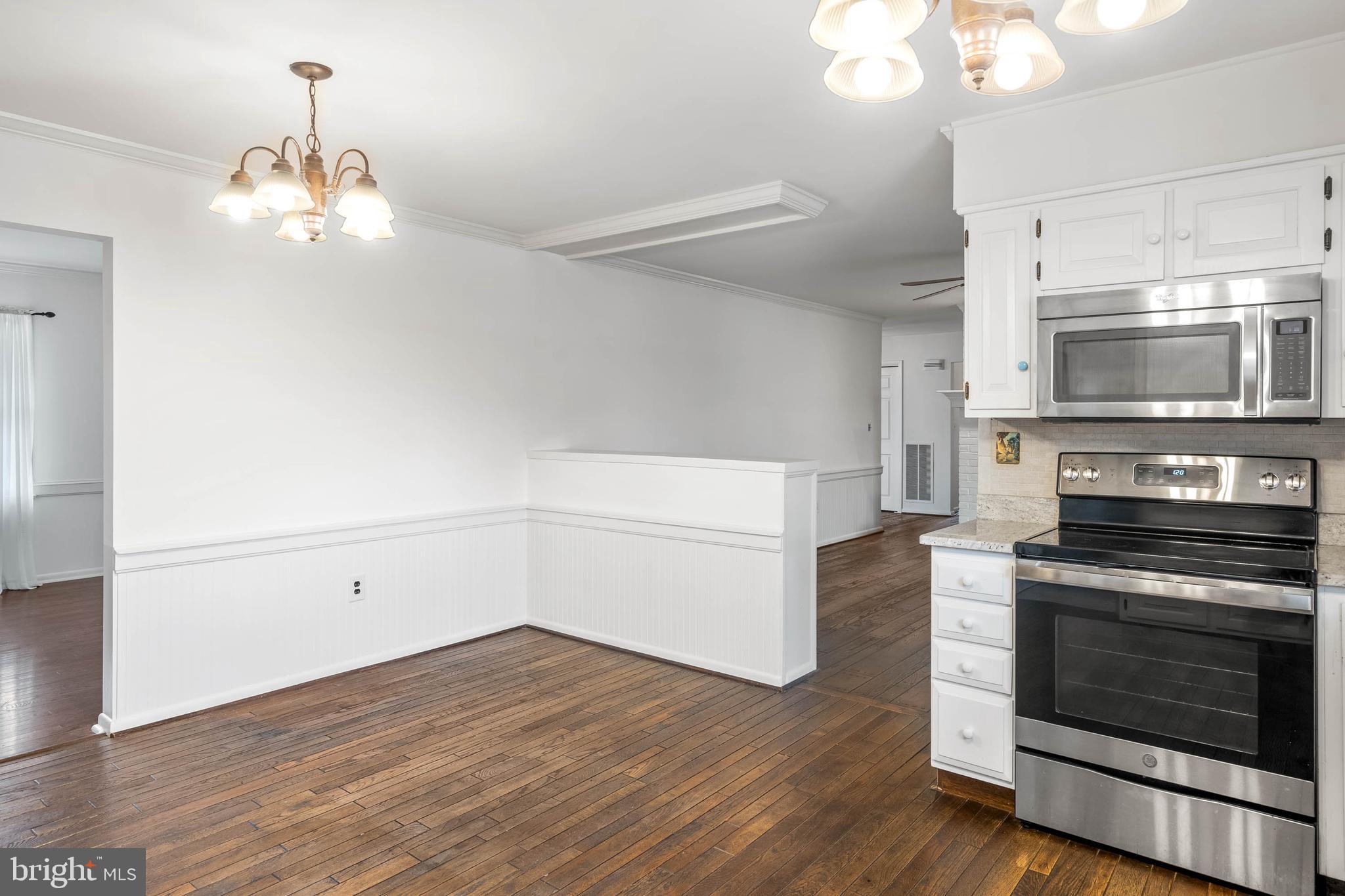 27 Devries Circle Lewes, DE 19958 - Photo 11 of 40 a kitchen with a stove and a microwave